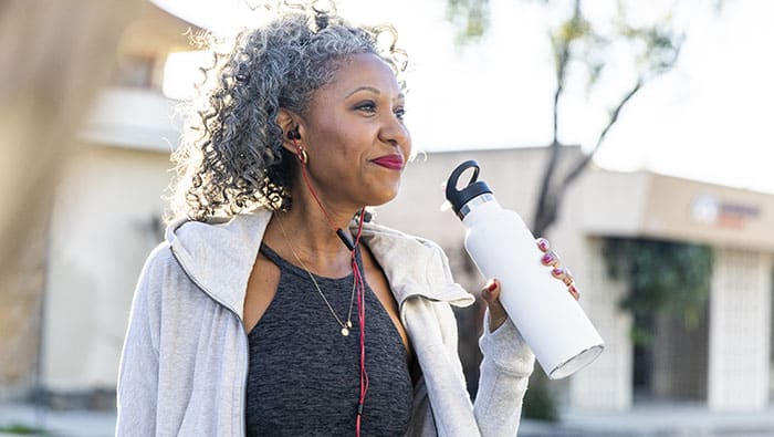 Beautiful black woman working out in the city
